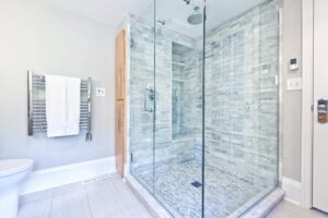 A glass shower with a tile floor in a Phoenix home